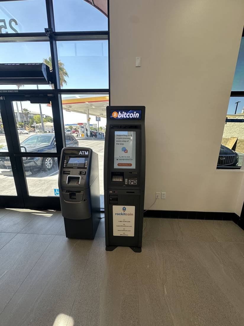 Bitcoin ATM placed alongside a conventional ATM at a host site