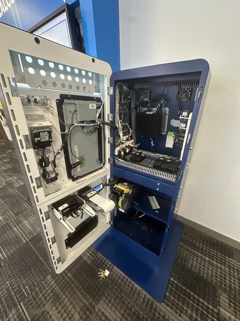 Self-service kiosk opened up for internal diagnosis