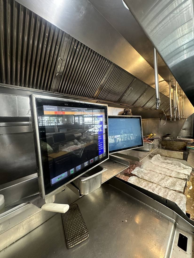 Order and kitchen display screens installed on a service line