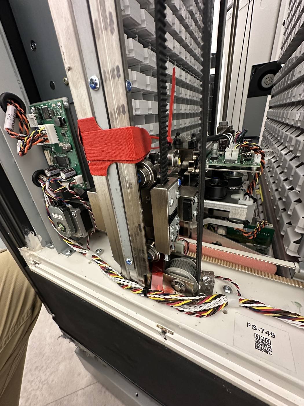 Open locker compartment showing the controller board, UPS, and wiring