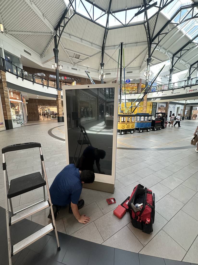 Installing a freestanding interactive directory in a shopping center